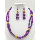 A Mary Quant style necklace and earrings set with synthetic amethyst, following the philosophy of
