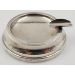 A Vintage Silver Ashtray. Art Deco Design, with stylish cigarette holder attached. 5cm diameter. 41g