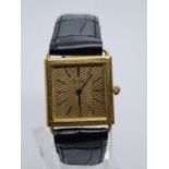 Piaget Vintage WATCH Tank style with square face and black leather strap. 23mm case.