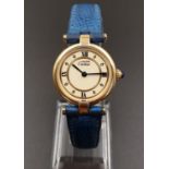 Cartier Quartz Ladies WATCH. Gold plated on Silver with Roman Numerals and Blue Leather Strap. 24mm.