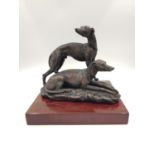 A 2003 signed brass sculpture by Posa - depicting two greyhounds. One at rest, the other alert.