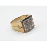 A Gents 18ct Gold and Diamond (2.5 carats) Fashion Ring. 9 Diamonds on face, 2 on shoulders. Size X.