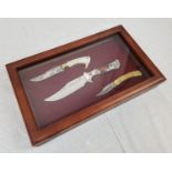 Three Solingen, Germany cased decorated hunting knives issued by the Franklin Mint. With