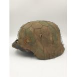 100% Original German M35 Helmet in Normandy Cam. The textured paint work appears to be of the period