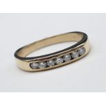 9ct yellow gold channel set diamond 1/2 eternity ring. 0.30ct, weighs 2.2g and size M.