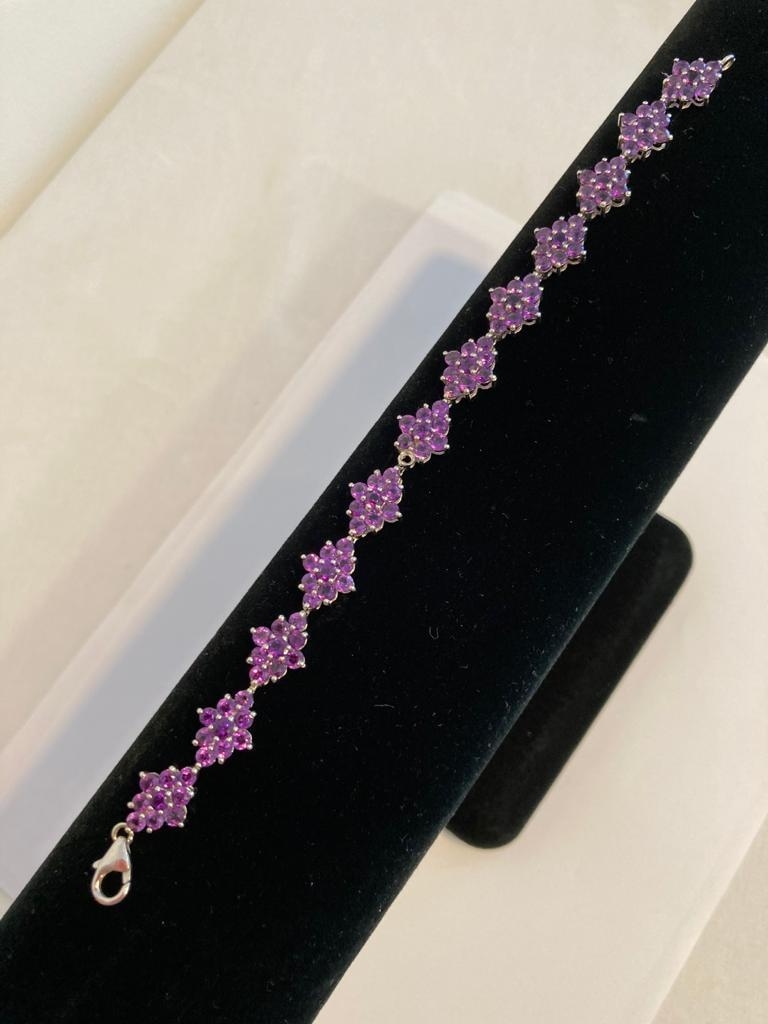 Silver and Amethyst TENNIS BRACELET. Marking for 925 Silver. 18.5cm