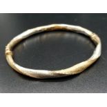 9ct Yellow and White Gold Twisted BANGLE. 6.1g 6.5cm inner diameter. in a Jeweller's Presentation