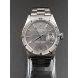 Rolex Stainless Steel Oyster Perpetual WATCH with date box and Silver face. 32mm