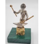 A 20TH CENTURY ITALIAN SILVER AND MALACHITE FIGURINE OF A NAKED BLACKSMITH STANDING 10CMS TALL AND