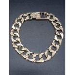 A gents, 9 carat, bracelet consisting of alternating smooth and stone wall effect links. Total