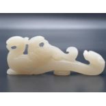 CHINESE JADE FIGURINE OF A DRAGON . 44.1 gms and 8 cms IN LENGTH