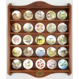 The Centenary Collection from the Bradford Exchange. A wooden hanging display case that holds 25