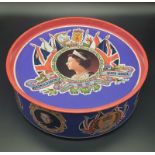 A LARGE COLLECTABLE BISCUIT TIN FROM THE QUEENS SILVER JUBILEE (1977) 25cms DIAMETER AND 7.5cms DEEP