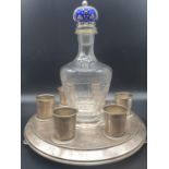 AN ANTIQUE RUSSIAN SILVER AND ENAMEL VODKA SET COMPRISING OF A SILVER TRAY, 6 SILVER SHOT CUPS AND A