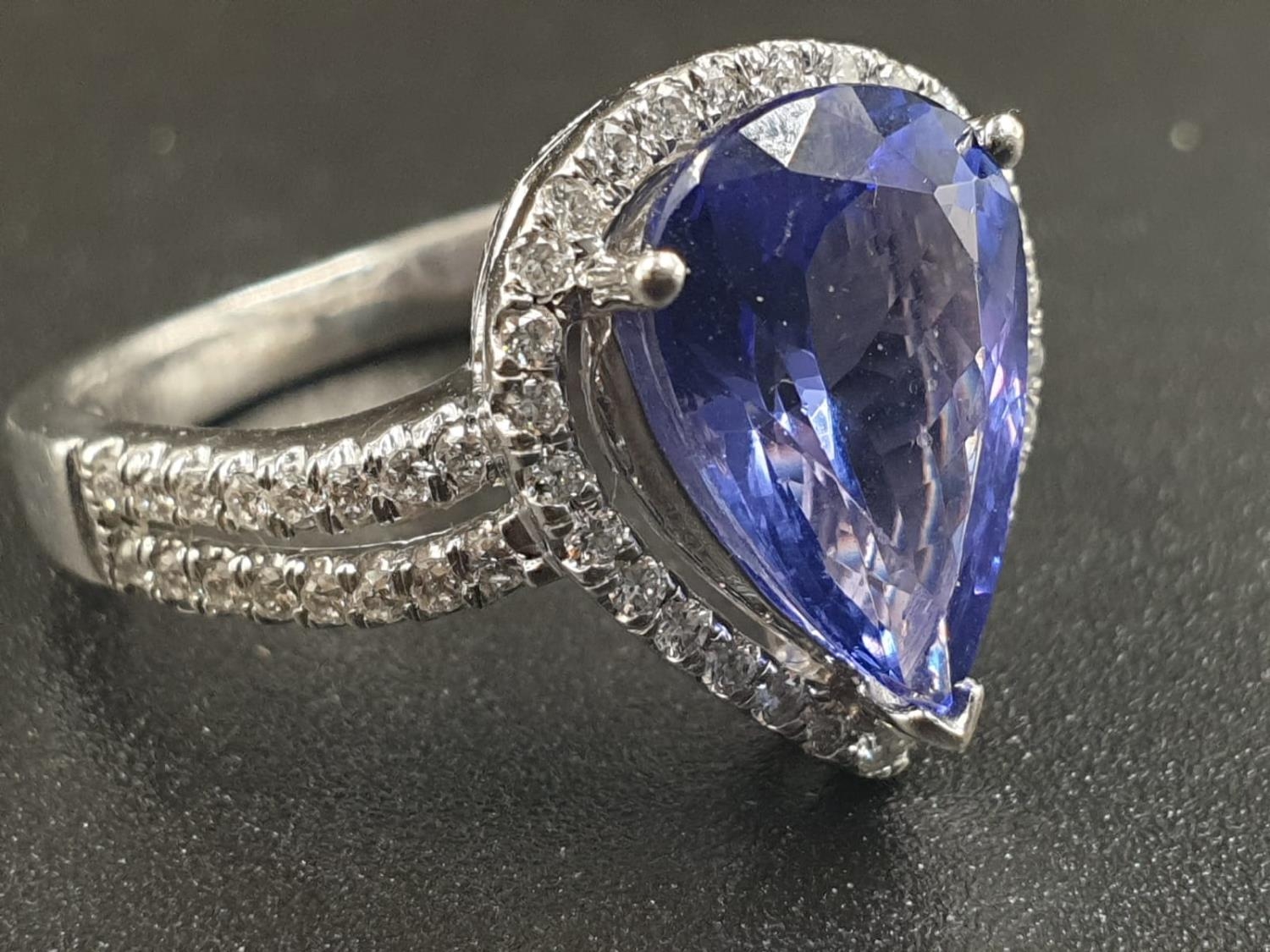 A 14CT WHITE GOLD MATCHING SET OF EARRINGS AND DRESS RING WITH LARGE PEAR SHAPED TANZANITE STONES - Image 3 of 14