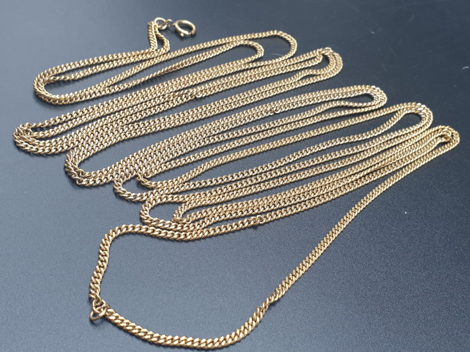 yellow metal chain 280 cms long and 44gms in weight