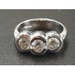 AN 18CT WHITE GOLD RING WITH A TRILOGY OF DIAMONDS OF OVER 1CT. 6.7gms SIZE O
