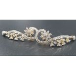 A fabulous 18 carat gold and diamonds pair of earrings. Earrings length: 4cm. Total weight: 10g.