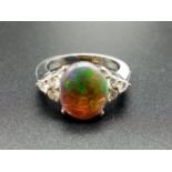 18ct white gold opal ring, 10x12mm opal centre and diamonds on shoulders, weight 10g and size N1/2