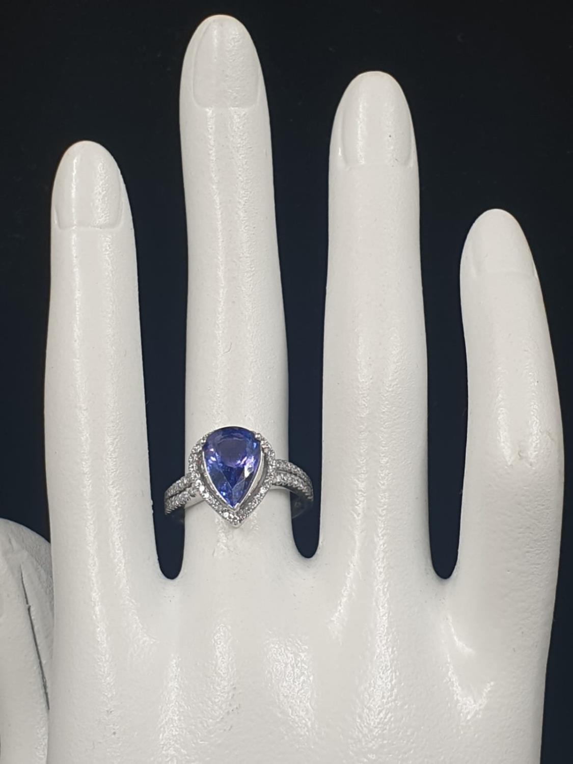 A 14CT WHITE GOLD MATCHING SET OF EARRINGS AND DRESS RING WITH LARGE PEAR SHAPED TANZANITE STONES - Image 7 of 14