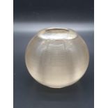 AN ART DECO ASHTRAY/CANDLE HOLDER MADE IN HEAVY GLASS BALL SHAPE WITH A SILVER COLLAR HALLMARKED