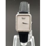 Chopard Ladies WRISTWATCH with Diamond Bezel, manual movement. Leather Strap. 20mm
