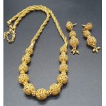 A beautiful, 22 carat yellow gold, Indian style, necklace and earrings set. Necklace length: 45