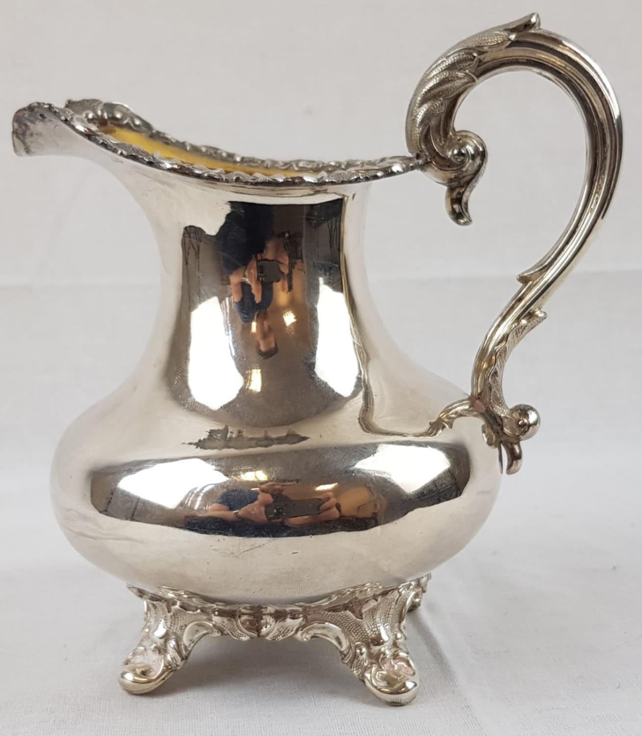 An Antique Silver Creamer. Rich Internal Gilding, with beautiful decoration on the pedestal base,