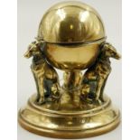 A VICTORIAN BRASS INKWELL IN THE FORM OF 3 DOGS SUPPORTING A GLOBE. WEIGHING JUST OVER 500gms AND