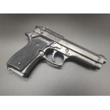 Replica Beretta Handgun. With slide out magazine, heavy metal feel. Dry firing action, takes inert