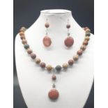 A rare silver and jasper necklace and earrings set with fossil red horn corals (300 million years