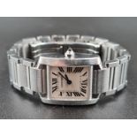 A LADIES CARTIER TANK STYLE WATCH WITH QUARTZ MOVEMENT , ROMAN NUMERALS AND SAPHIRE WINDER 24MM