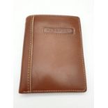 A Leather Passport Holder and Wallet made by Fossil. Unused, as new.