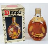 Bottle of Dimple Scotch Whisky. 26 2/3 Fl. OZs. Comes in Original Box.