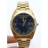 Astron Gold Plated Watch. Blue Dial, Day and Date. As New, In Box. As Found - needs new battery.