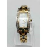 Accurist ladies cocktail watch with mother of pearl face and two tone metal decorated bezel and