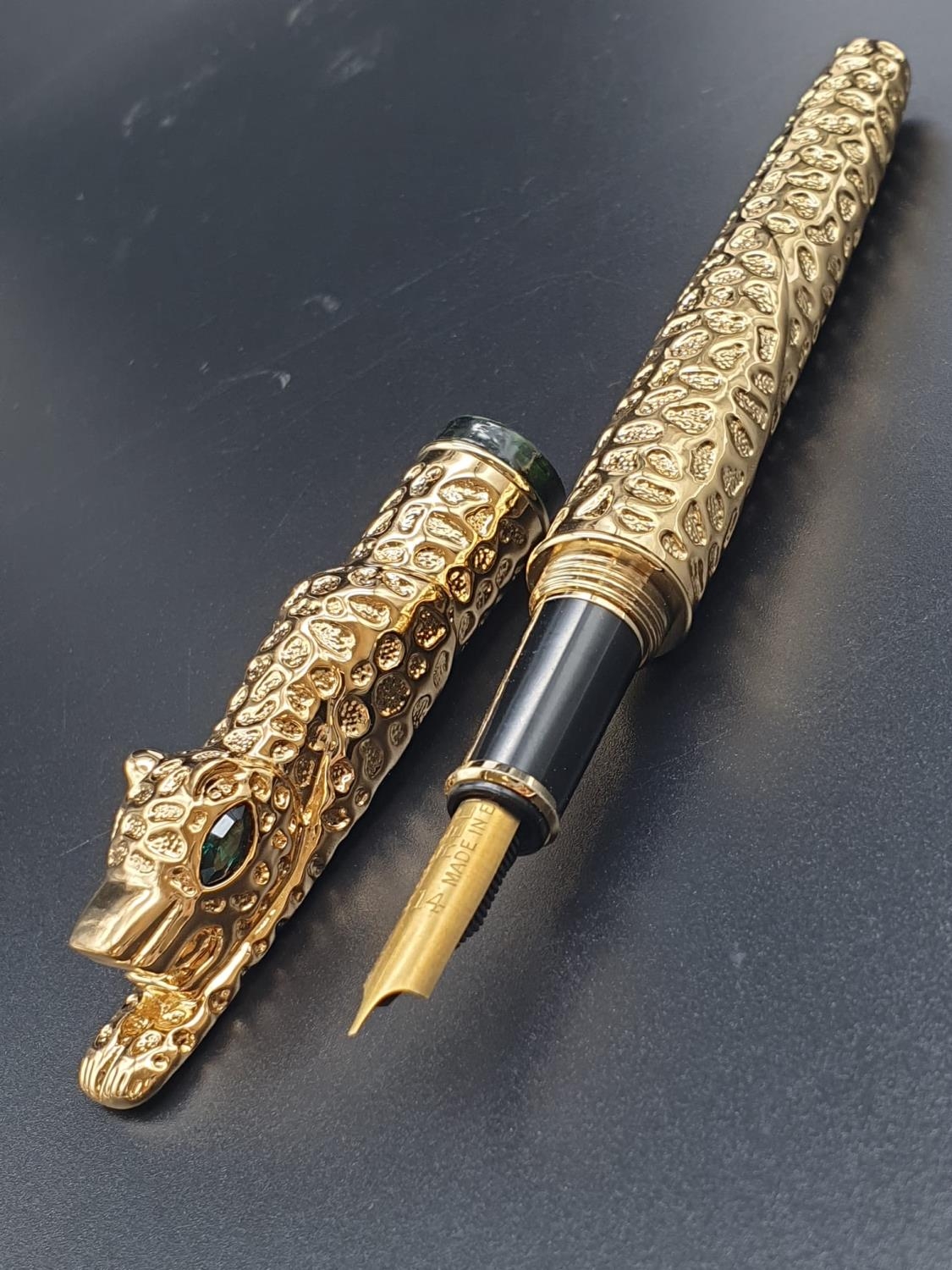 A rare and beautiful, Cartier style, gold filled, fountain pen in a velvet pouch.