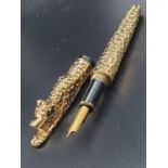 A rare and beautiful, Cartier style, gold filled, fountain pen in a velvet pouch.