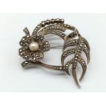 Victorian silver filigree brooch with pearl in floral design, weight 12.7g and 45mm wide approx