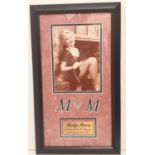 An astonishing piece of movie history. A framed picture of the legendary Marilyn Monroe containing a