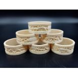 Six Antique Ivory Hand-Carved with Chinese Decoration Napkin Rings. 5cm diameter.