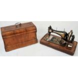 A FINELY DECORATED ANTIQUE SEWING MACHINE IN WOODEN CARRYING CASE MADE BY FRISTER AND ROSSMAN CICA