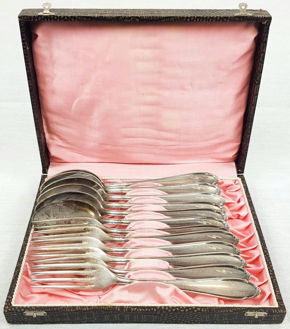 1945 Dated Waffen SS Fork & Spoon Set. 6 Forks & 6 Spoons bearing the Waffen SS Runes.