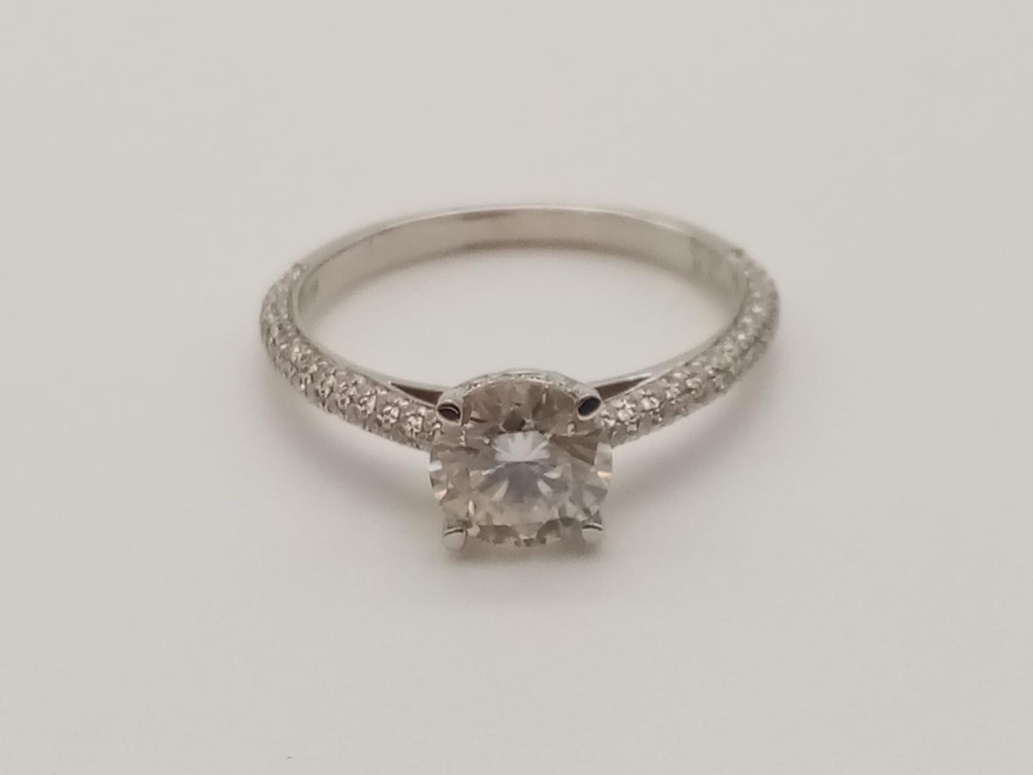 18k white gold 1ct moissanite diamond solitaire ring with further 0.51ct stones on shoulders, weight