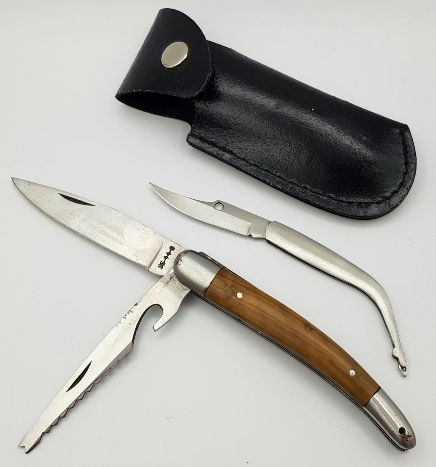 Two vintage locks knives: one utility in sheath and one pendant knife. Larger knife measures 23cm