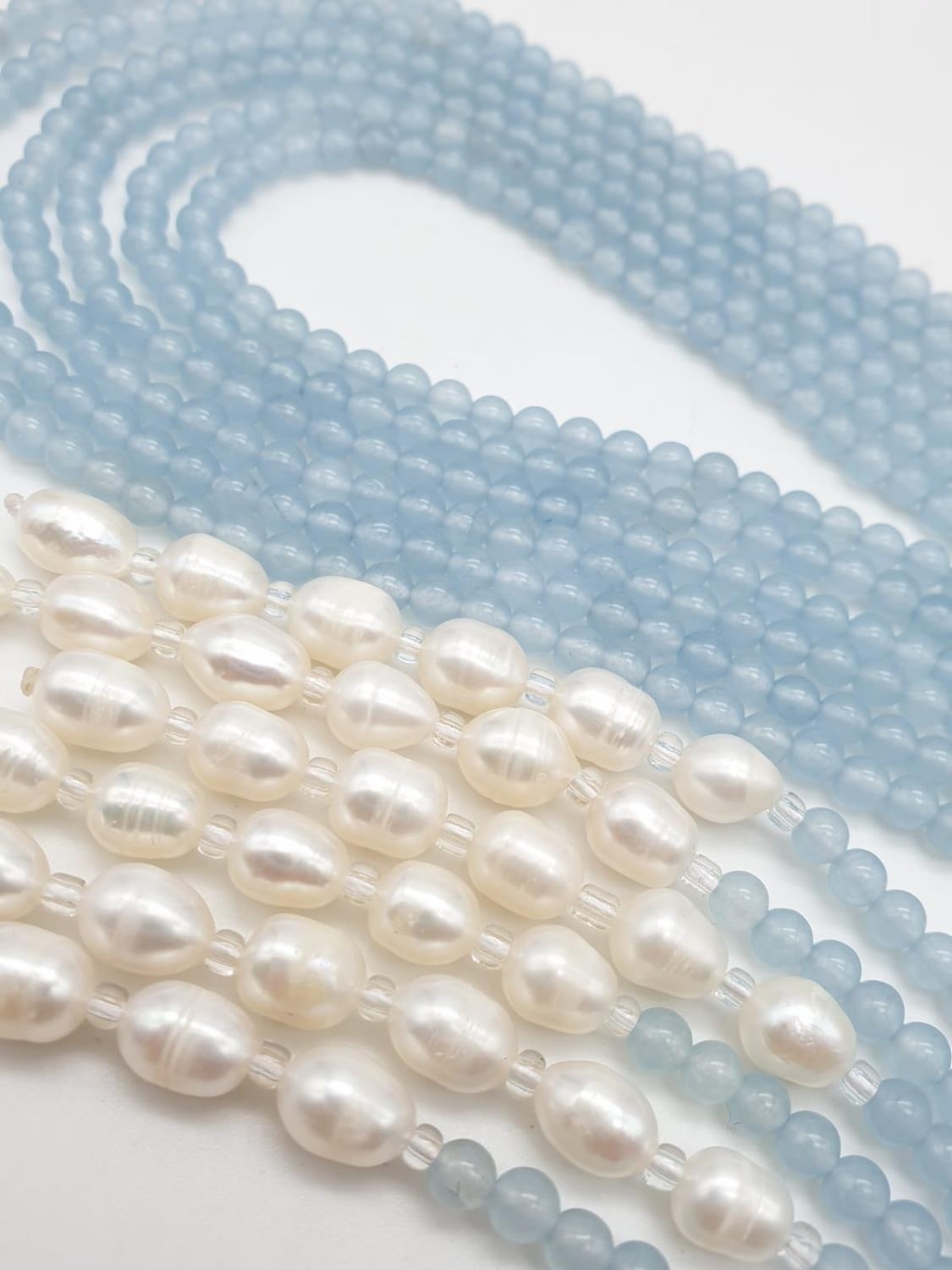 Three very long rows (128cm!) of aquamarine (colour enhanced) and natural pearls that can form a - Image 4 of 10