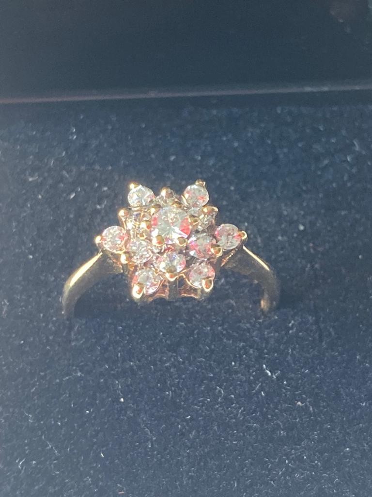 Stone set 9 carat gold cluster ring. Full London hallmark ,2.5 grams approx ,size M1/2.