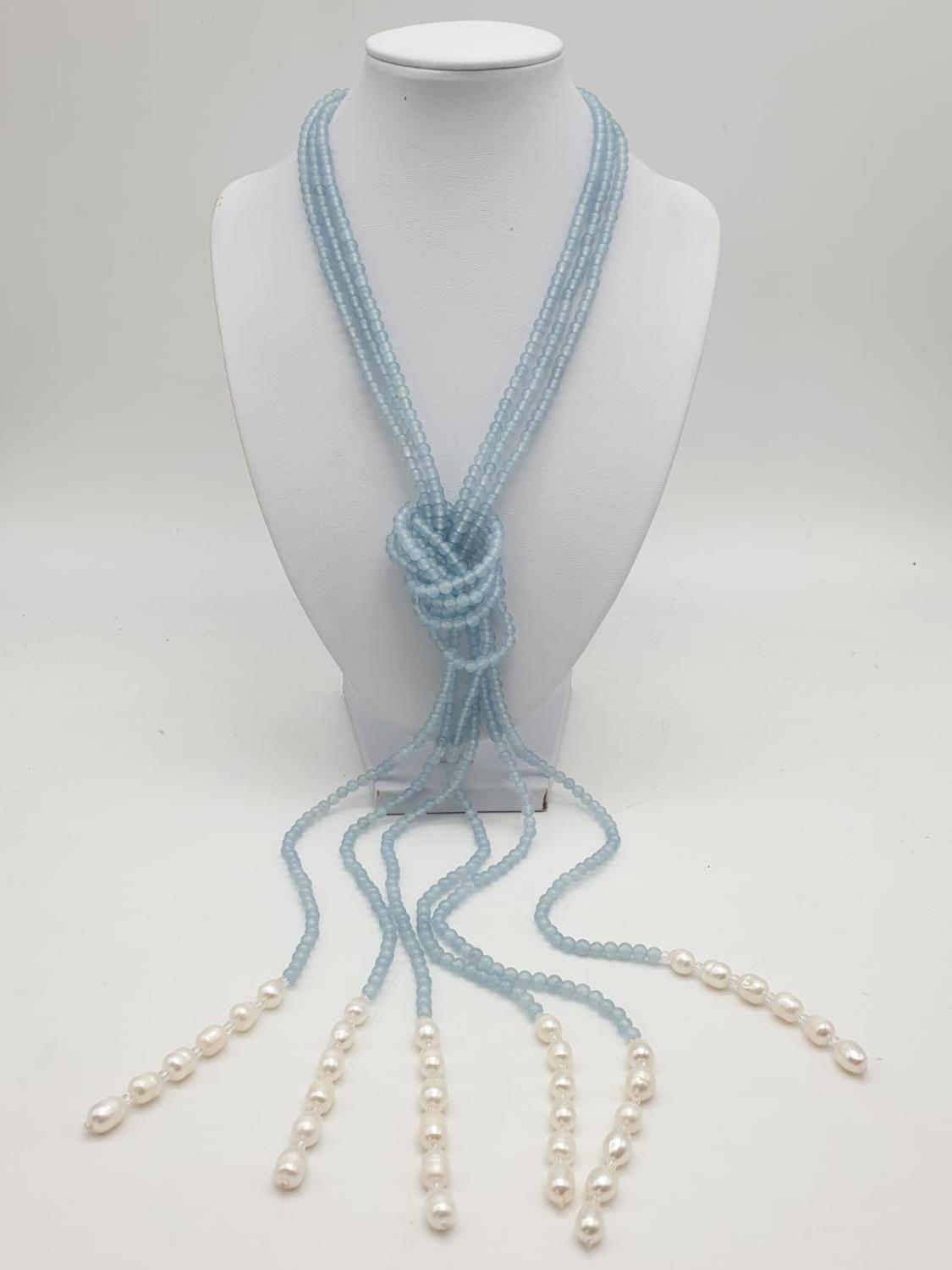 Three very long rows (128cm!) of aquamarine (colour enhanced) and natural pearls that can form a - Image 2 of 10