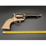 Gun Replica of an 1873 USA .45 Calibre Peacemaker. Two-Tone heavy metal, revolving cylinder single-