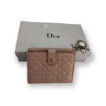 Dior pink leather purse with original receipt and box and pouch; in mint condition